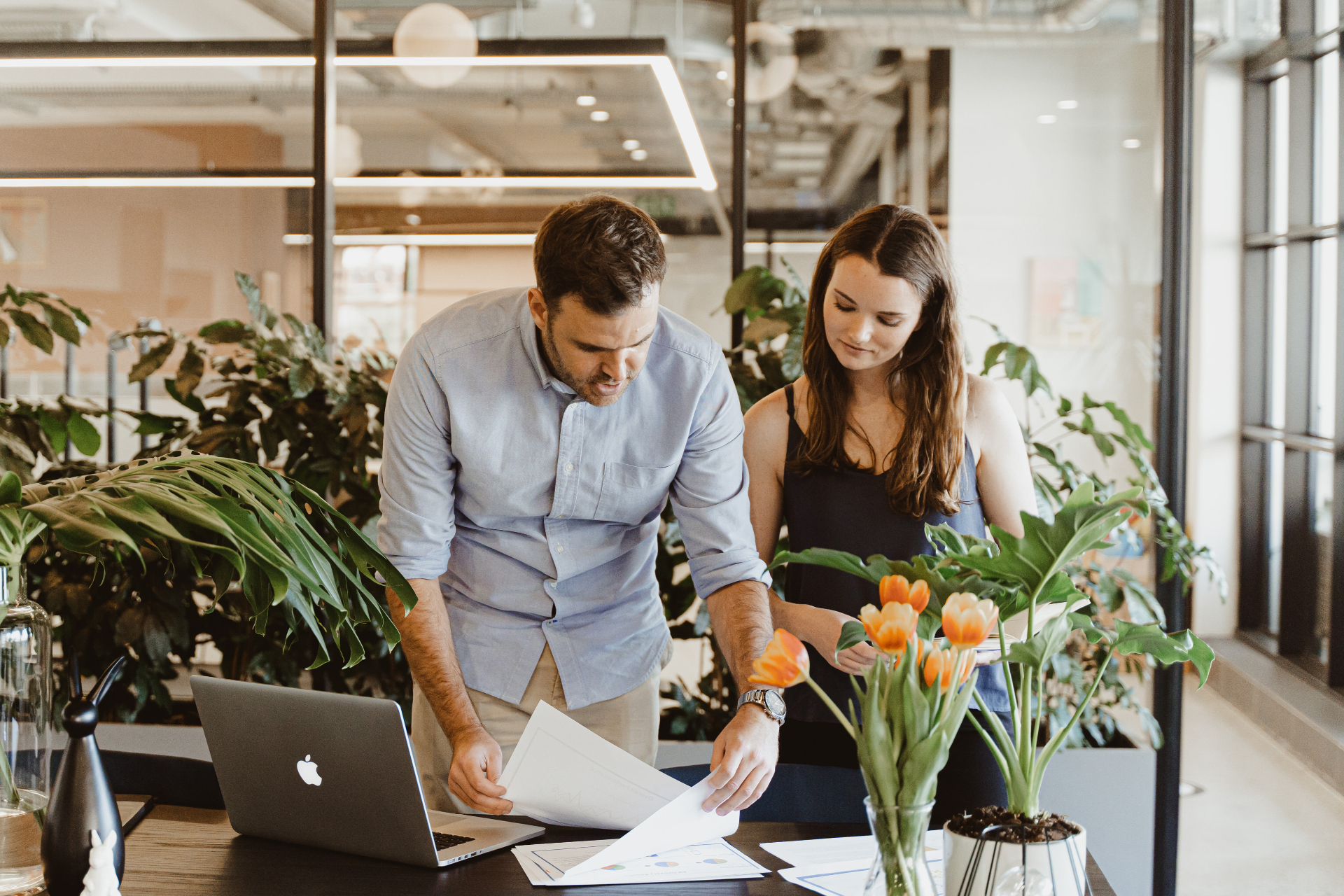Two team members reviewing strategy together in a bright modern office